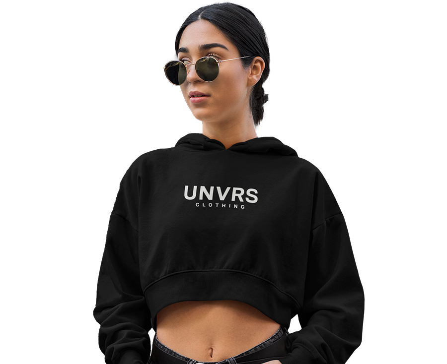 Female model wearing a black UNVRS sweatshirt featuring the brand logo on the chest. The sweatshirt has a relaxed fit, making it perfect for a casual, streetwear look inspired by Ibiza's bold club fashion scene.